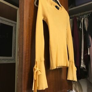 yellow bell-sleeved top